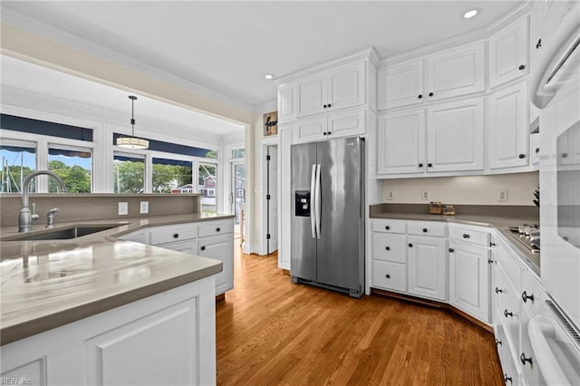 200 Congress Ave, Hampton, VA 23669 - kitchen featuring stainless steel appliances, a sink, recessed lighting, white cabinets, and ornamental molding