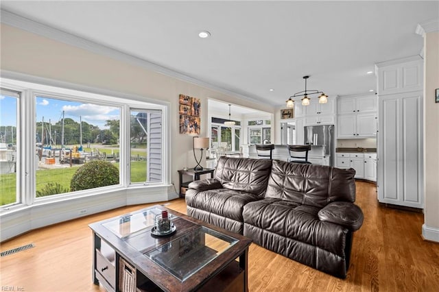 200 Congress Ave, Hampton, VA 23669 - living area with healthy amount of natural light, wood finished floors, crown molding, and recessed lighting