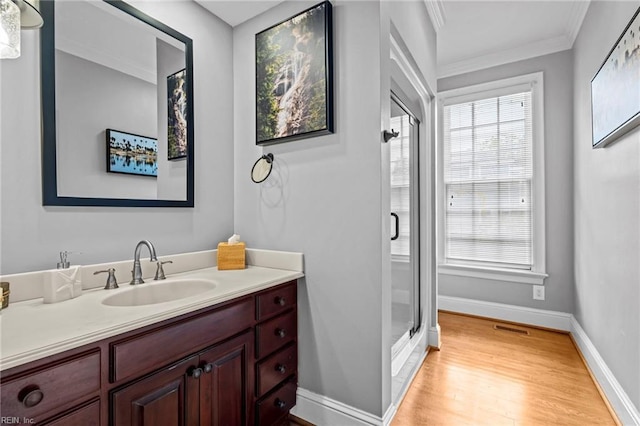 200 Congress Ave, Hampton, VA 23669 - bathroom featuring vanity, a stall shower, wood finished floors, crown molding, and baseboards