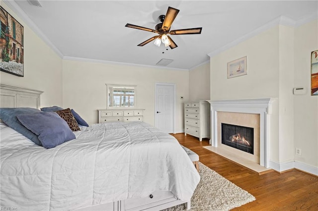 200 Congress Ave, Hampton, VA 23669 - bedroom featuring ornamental molding, wood finished floors, a premium fireplace, ceiling fan, and baseboards