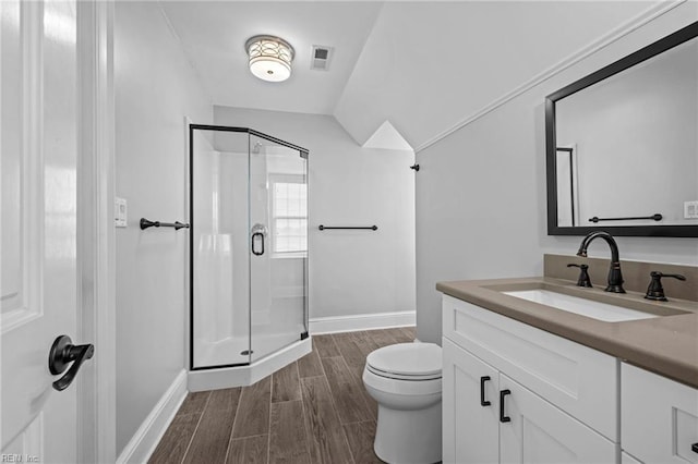 200 Congress Ave, Hampton, VA 23669 - full bathroom with baseboards, vanity, a stall shower, toilet, and wood finished floors