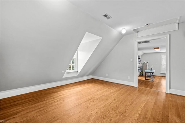 200 Congress Ave, Hampton, VA 23669 - additional living space featuring attic access, wood finished floors, lofted ceiling, healthy amount of natural light, and baseboards