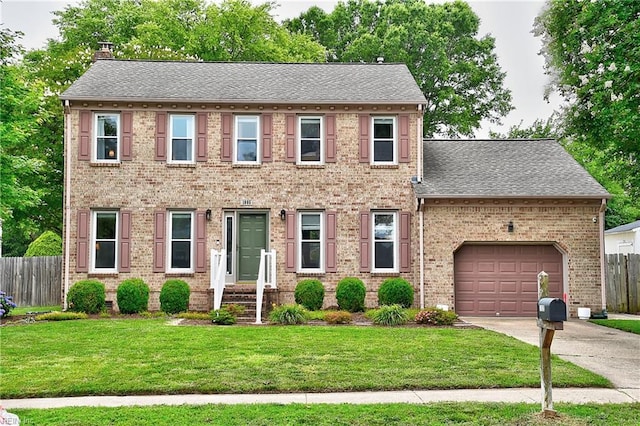 1005 Minden Rd, Virginia Beach, VA 23464 - view of front of home with a garage, driveway, a chimney, roof with shingles, and brick siding