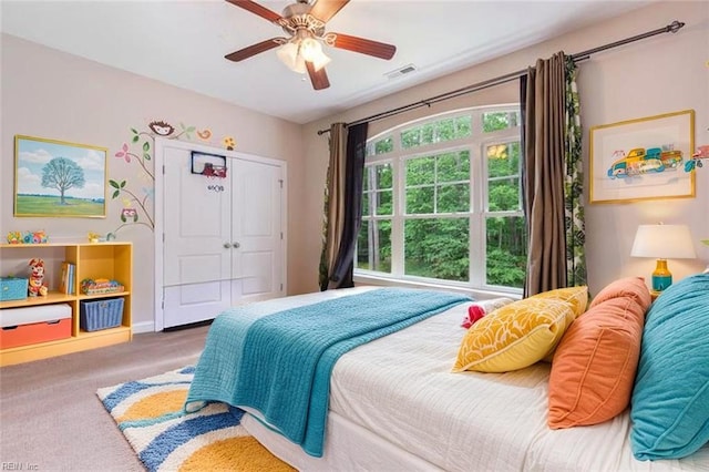 4437 Cherokee Dr, Suffolk, VA 23434 - carpeted bedroom with a closet, a ceiling fan, and baseboards