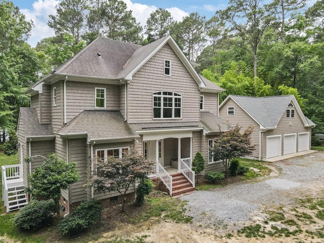 4437 Cherokee Dr, Suffolk, VA 23434 - shingle-style home with a shingled roof, an outdoor structure, a garage, and covered porch