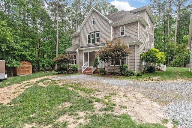 4437 Cherokee Dr, Suffolk, VA 23434 - view of front of property featuring covered porch, a front yard, and gravel driveway