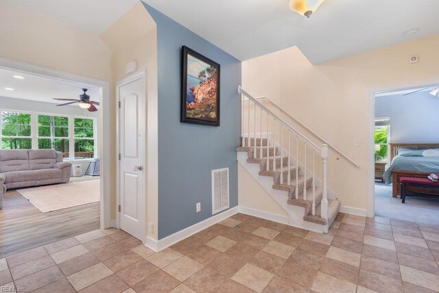 4437 Cherokee Dr, Suffolk, VA 23434 - stairway featuring ceiling fan, baseboards, and stone finish floors
