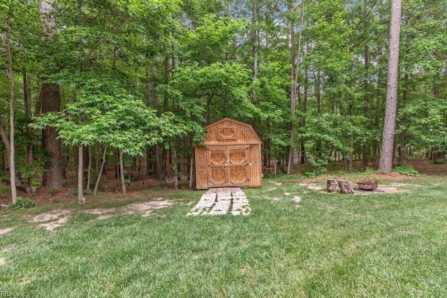 4437 Cherokee Dr, Suffolk, VA 23434 - view of green lawn with a wooded view and an outdoor fire pit