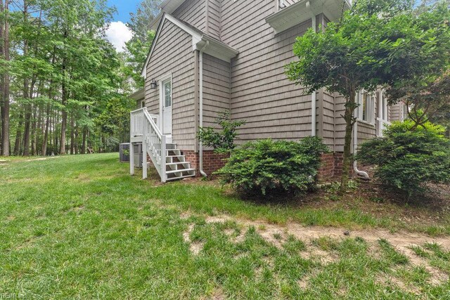 4437 Cherokee Dr, Suffolk, VA 23434 - view of side of home with a lawn, central AC unit, and stairs