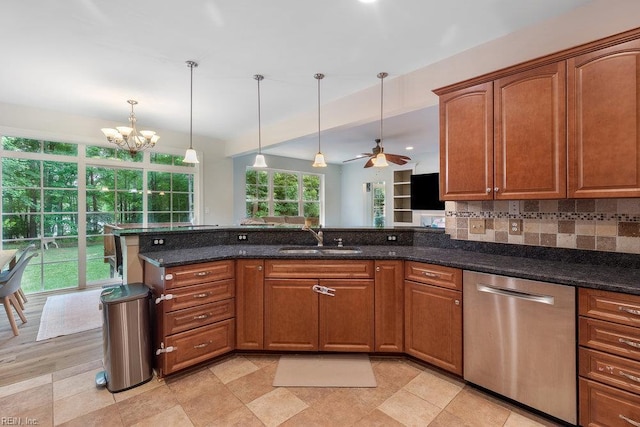 4437 Cherokee Dr, Suffolk, VA 23434 - kitchen featuring stainless steel dishwasher, a sink, a chandelier, pendant lighting, and dark stone counters