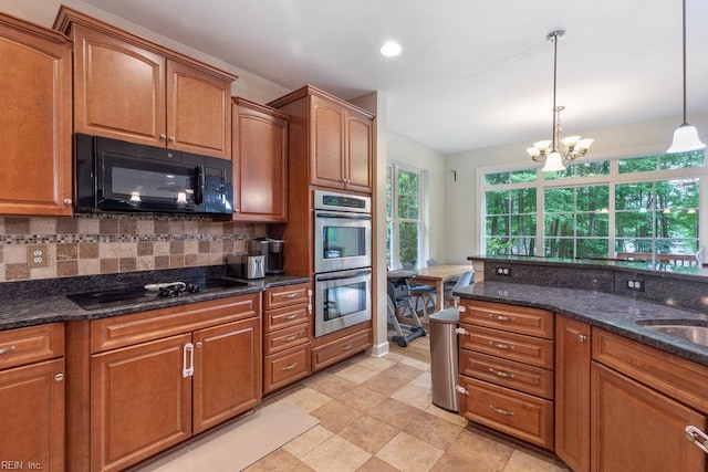 4437 Cherokee Dr, Suffolk, VA 23434 - kitchen featuring black appliances, backsplash, pendant lighting, brown cabinetry, and a chandelier