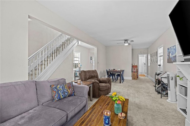 2105 Portlock Rd, Chesapeake, VA 23324 - carpeted living area with stairs, a ceiling fan, and baseboards