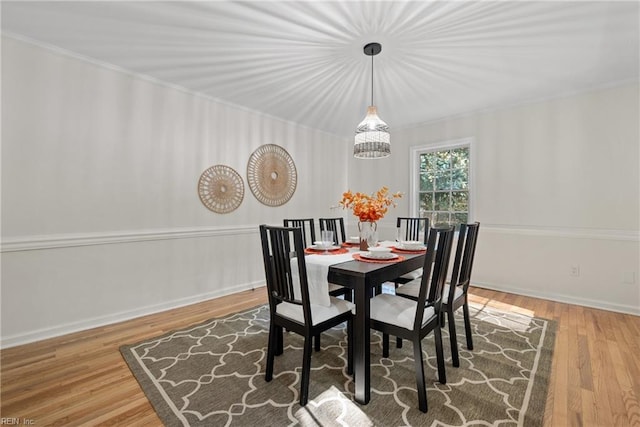 166 Windward Way, Port Haywood, VA 23138 - dining area featuring wood finished floors, a chandelier, crown molding, and baseboards