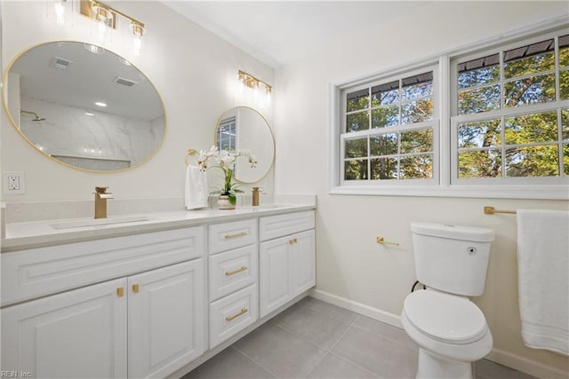 166 Windward Way, Port Haywood, VA 23138 - bathroom with double vanity, baseboards, tile patterned floors, and toilet