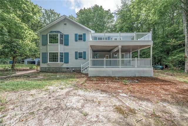166 Windward Way, Port Haywood, VA 23138 - rear view of property featuring view of wooded area and a balcony