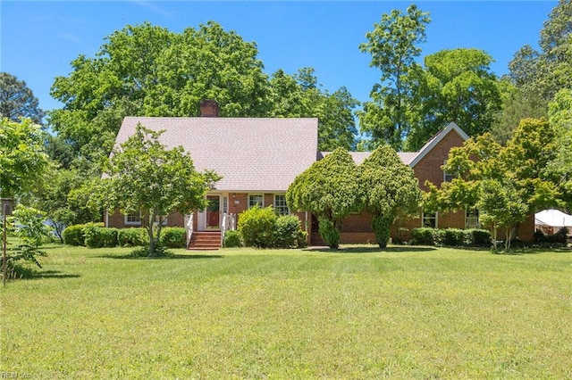 2543 Bridge Rd, Suffolk, VA 23435 - view of front of home with a front yard and a chimney