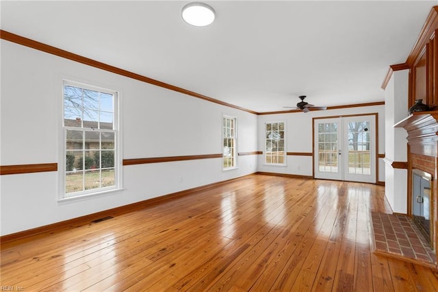 2543 Bridge Rd, Suffolk, VA 23435 - unfurnished living room featuring a brick fireplace, light wood-type flooring, ornamental molding, a ceiling fan, and baseboards