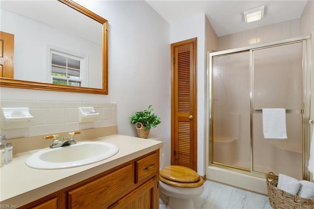 2543 Bridge Rd, Suffolk, VA 23435 - full bath featuring a shower stall, vanity, toilet, marble finish flooring, and a closet