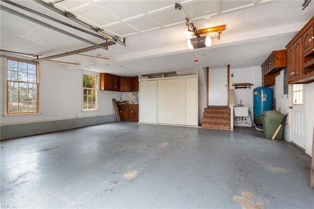 2543 Bridge Rd, Suffolk, VA 23435 - garage featuring a garage door opener and a sink