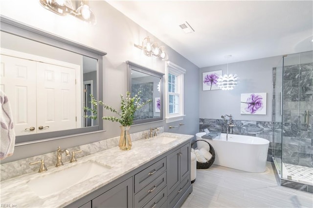 3512 Quail Holw, Williamsburg, VA 23185 - full bath with a shower stall, a soaking tub, double vanity, and tile walls