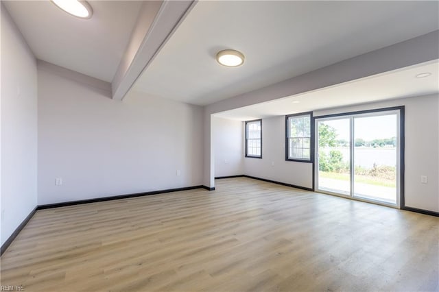 1943 Sycamore Ln, Norfolk, VA 23523 - spare room with beamed ceiling, baseboards, light wood-type flooring, and a water view