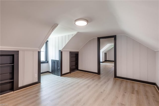 1943 Sycamore Ln, Norfolk, VA 23523 - additional living space featuring lofted ceiling, light wood-style flooring, and a decorative wall