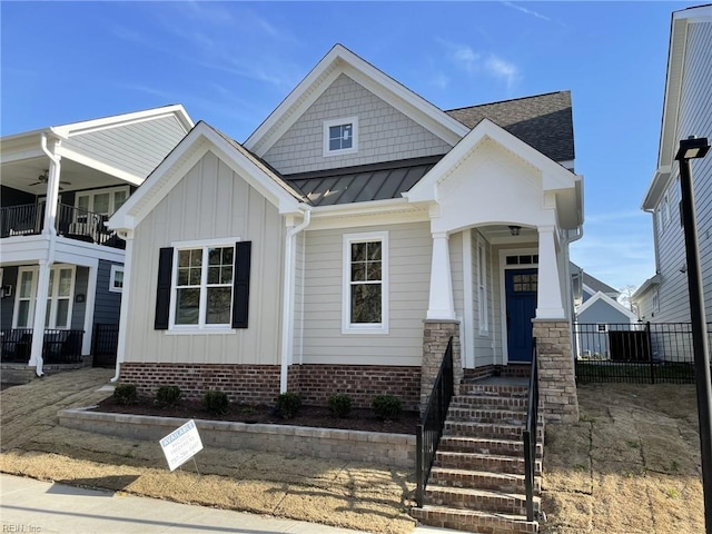 100 Creek Ln, Suffolk, VA 23435 - view of front facade with a standing seam roof, board and batten siding, metal roof, and a ceiling fan
