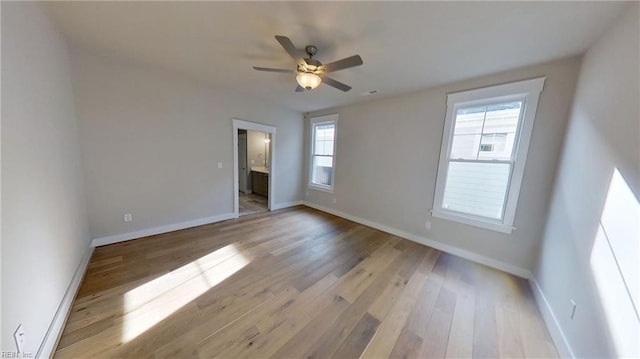 100 Creek Ln, Suffolk, VA 23435 - unfurnished room with light wood-style floors, ceiling fan, and baseboards