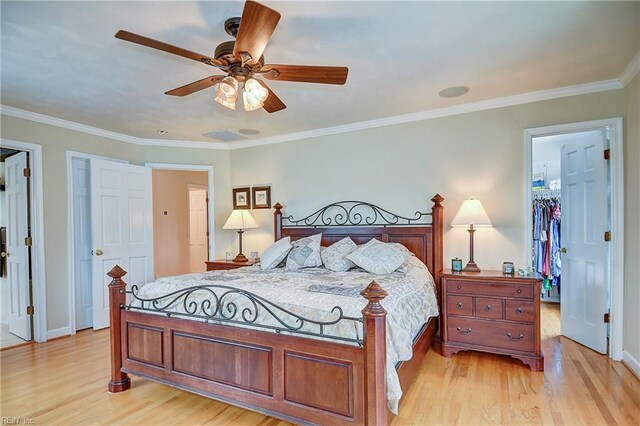 2637 Broad Bay Rd, Virginia Beach, VA 23451 - bedroom featuring light wood-style floors, a walk in closet, crown molding, ceiling fan, and a closet