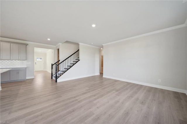 1232 Kidbrooke St, Chesapeake, VA 23322 - unfurnished living room with stairs, crown molding, light wood finished floors, recessed lighting, and baseboards