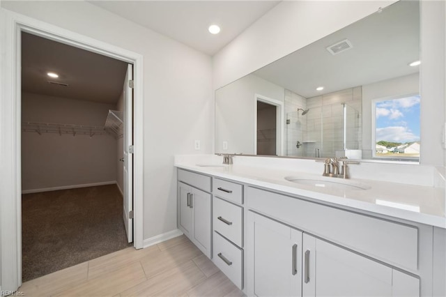 1232 Kidbrooke St, Chesapeake, VA 23322 - bathroom featuring a stall shower, a spacious closet, double vanity, baseboards, and recessed lighting