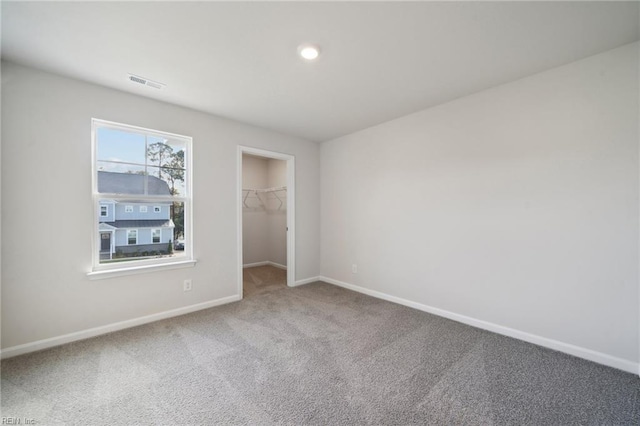 1232 Kidbrooke St, Chesapeake, VA 23322 - unfurnished bedroom with baseboards, carpet floors, a walk in closet, and a closet
