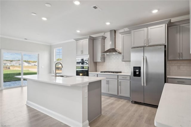 1232 Kidbrooke St, Chesapeake, VA 23322 - kitchen featuring appliances with stainless steel finishes, wall chimney exhaust hood, a sink, gray cabinets, and ornamental molding