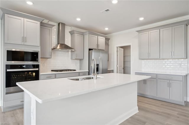 1232 Kidbrooke St, Chesapeake, VA 23322 - kitchen featuring appliances with stainless steel finishes, wall chimney range hood, gray cabinetry, a sink, and crown molding