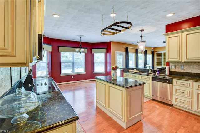 313 Queen Ct, Smithfield, VA 23430 - kitchen with cream cabinetry, stainless steel dishwasher, a sink, light wood finished floors, and recessed lighting