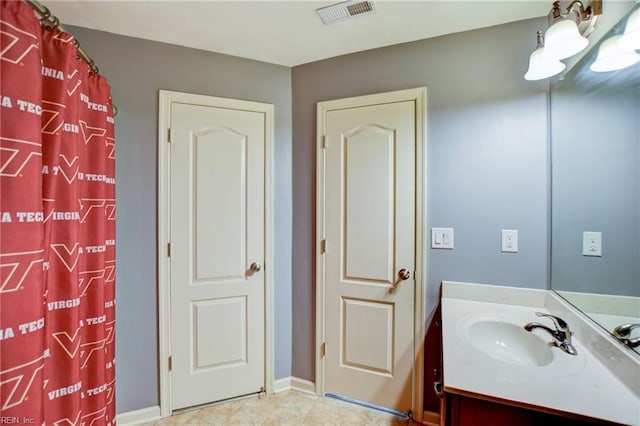 313 Queen Ct, Smithfield, VA 23430 - full bath with vanity, baseboards, and a shower with curtain