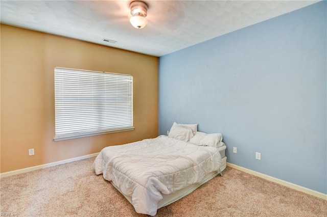 313 Queen Ct, Smithfield, VA 23430 - carpeted bedroom featuring baseboards