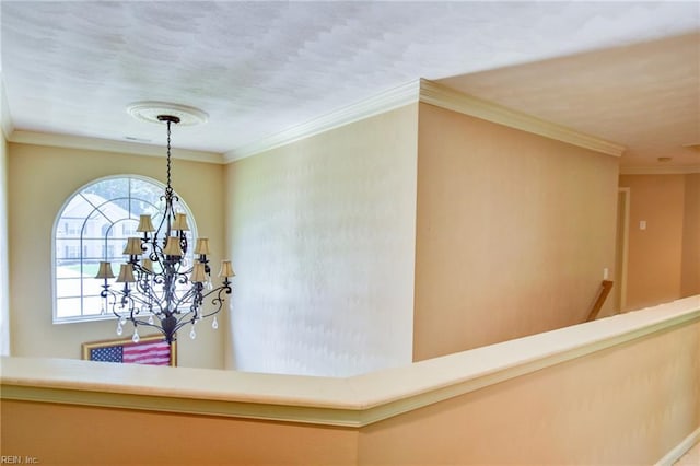 313 Queen Ct, Smithfield, VA 23430 - hall with a chandelier, an upstairs landing, and ornamental molding
