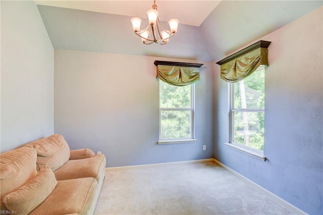 313 Queen Ct, Smithfield, VA 23430 - sitting room with a chandelier, carpet, baseboards, and vaulted ceiling