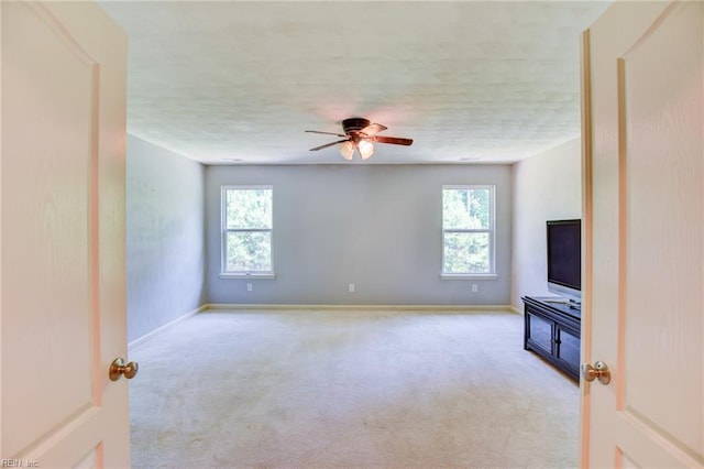 313 Queen Ct, Smithfield, VA 23430 - unfurnished living room featuring healthy amount of natural light, carpet, ceiling fan, and baseboards