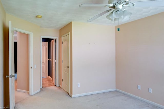 313 Queen Ct, Smithfield, VA 23430 - unfurnished bedroom featuring light carpet, baseboards, and a ceiling fan