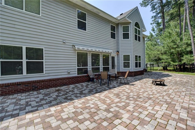 313 Queen Ct, Smithfield, VA 23430 - rear view of house with a patio area and an outdoor fire pit