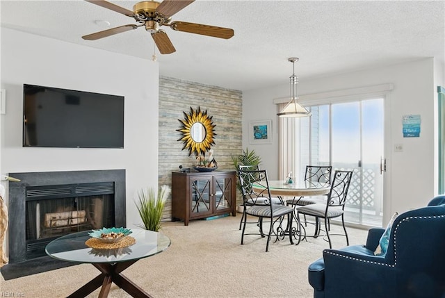 612 Shoreham Ct Unit 202, Virginia Beach, VA 23451 - dining area with carpet flooring, a fireplace, ceiling fan, and a textured ceiling