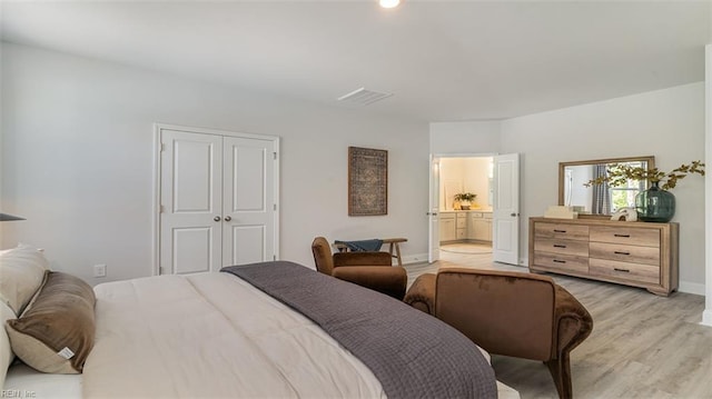 1228 Kidbrooke St, Chesapeake, VA 23322 - bedroom with light wood-style floors, baseboards, a closet, and ensuite bathroom