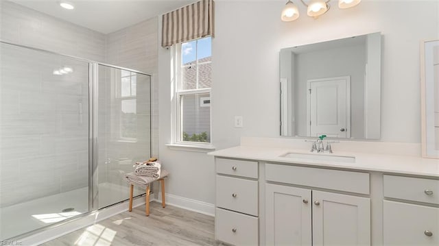 1228 Kidbrooke St, Chesapeake, VA 23322 - full bath with vanity, a stall shower, wood finished floors, baseboards, and a chandelier