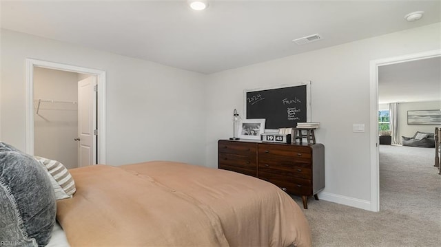 1228 Kidbrooke St, Chesapeake, VA 23322 - bedroom with light colored carpet, baseboards, and a walk in closet