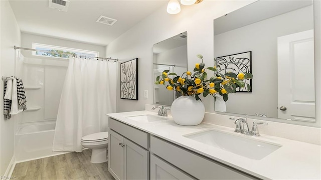 1228 Kidbrooke St, Chesapeake, VA 23322 - bathroom with toilet, wood finished floors, double vanity, and shower / tub combo with curtain