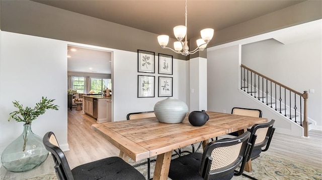 1228 Kidbrooke St, Chesapeake, VA 23322 - dining area featuring light wood-type flooring, a chandelier, and stairway