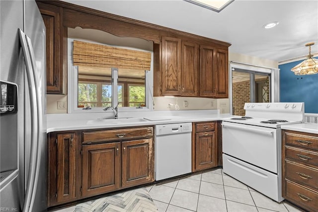 9 Hill Way, Carrollton, VA 23314 - kitchen featuring white appliances, light countertops, a sink, and light tile patterned flooring