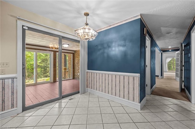 9 Hill Way, Carrollton, VA 23314 - unfurnished room with a chandelier, light tile patterned floors, and baseboards